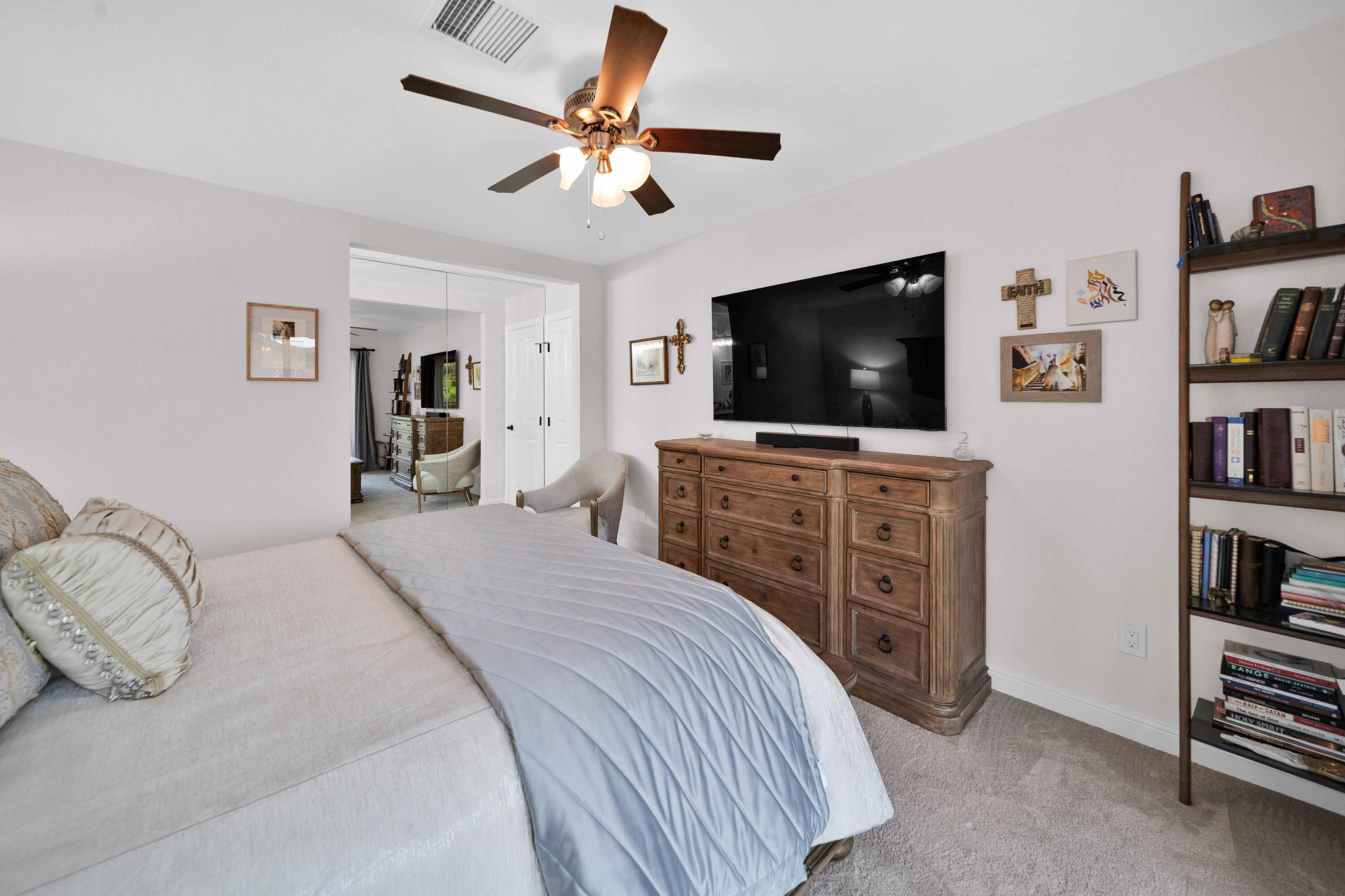 1928 Bechelli Lane Redding, CA 96002 - Photo 25 of 67 a bedroom with a bed and a flat screen tv