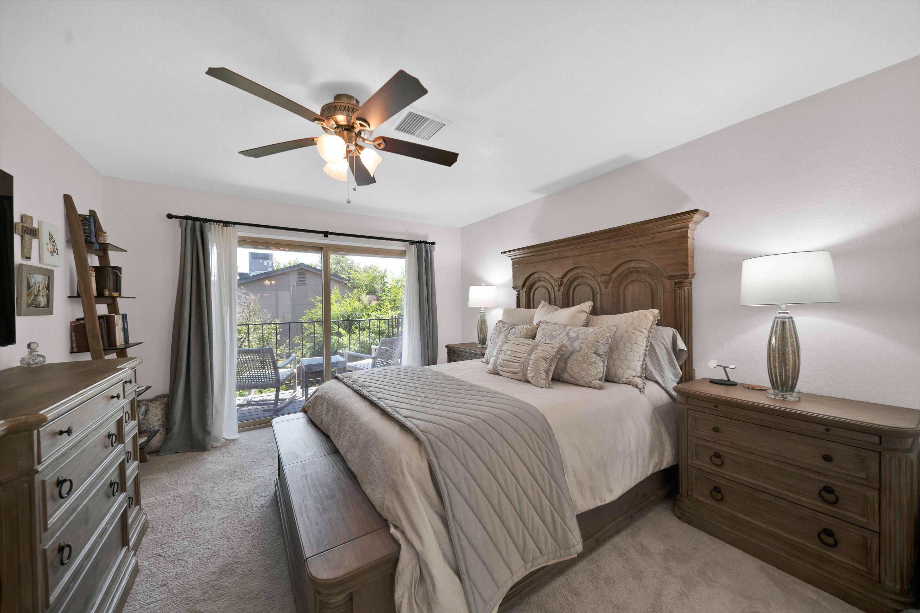 1928 Bechelli Lane Redding, CA 96002 - Photo 26 of 67 a bedroom with a bed and a chandelier