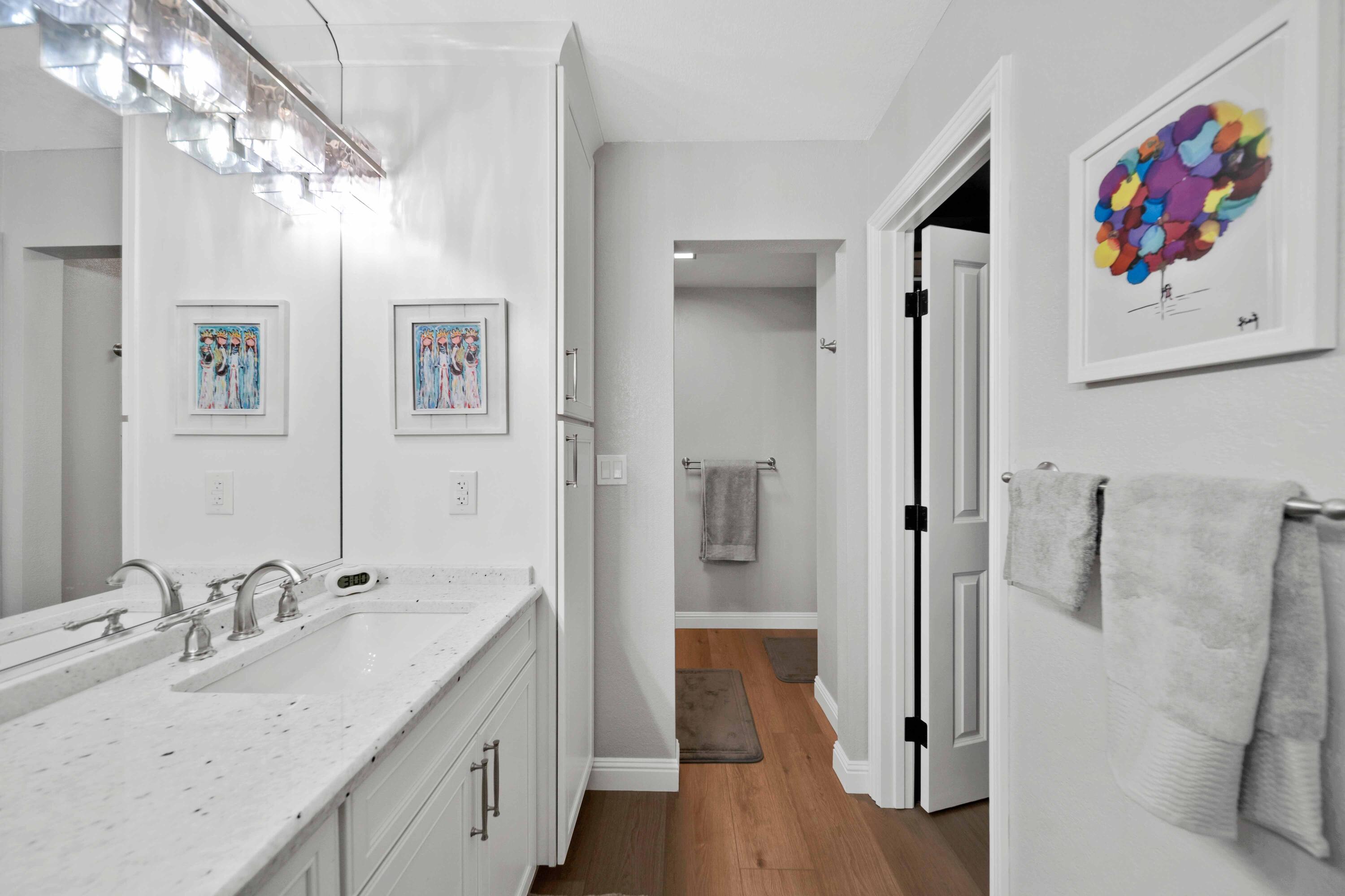 1928 Bechelli Lane Redding, CA 96002 - Photo 30 of 67 a spacious bathroom with a tub sink and mirror