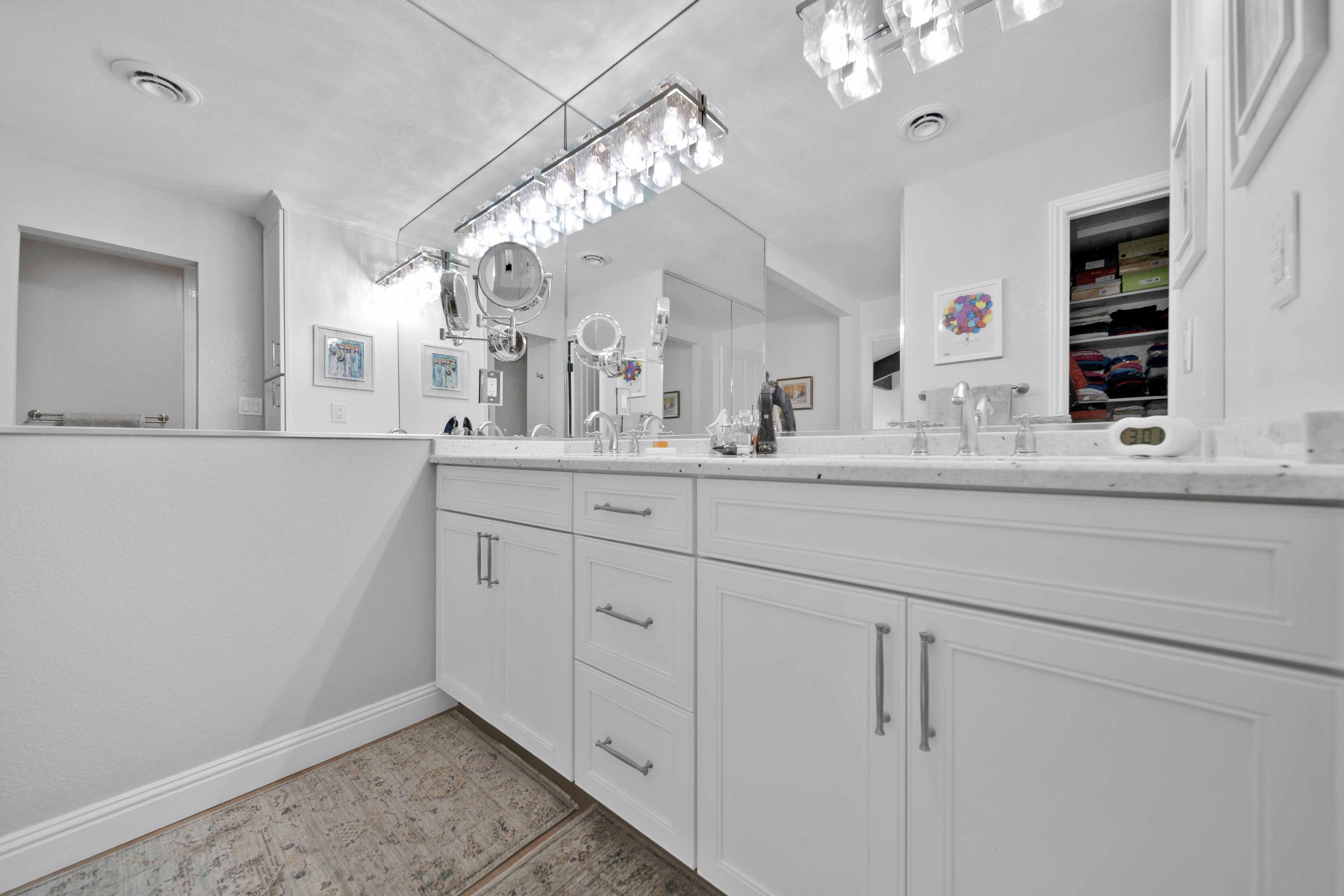 1928 Bechelli Lane Redding, CA 96002 - Photo 31 of 67 a bathroom with a sink vanity and mirror