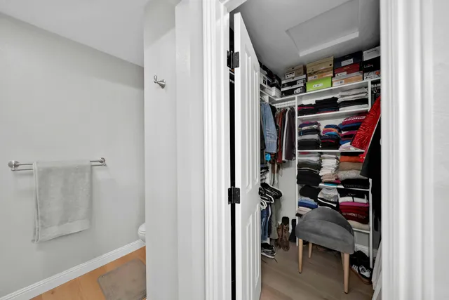 a sign that is sitting on a wooden bench in a yard