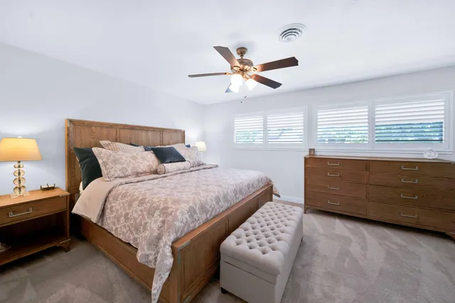 a front view of a house with a yard and a garage