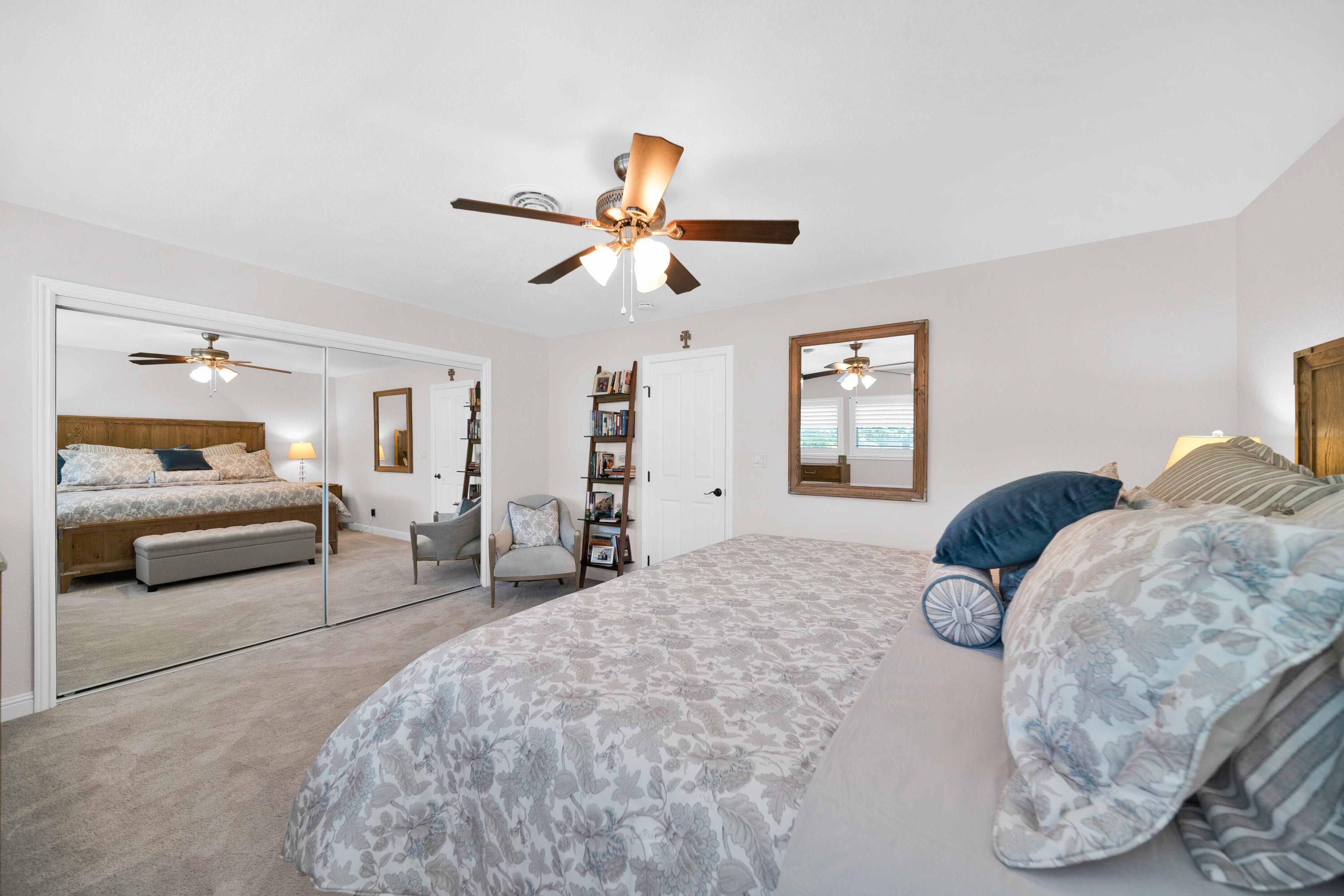 1928 Bechelli Lane Redding, CA 96002 - Photo 39 of 67 a bedroom with furniture and a chandelier