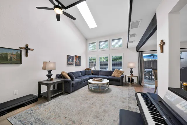 a kitchen with stainless steel appliances granite countertop a sink and a refrigerator