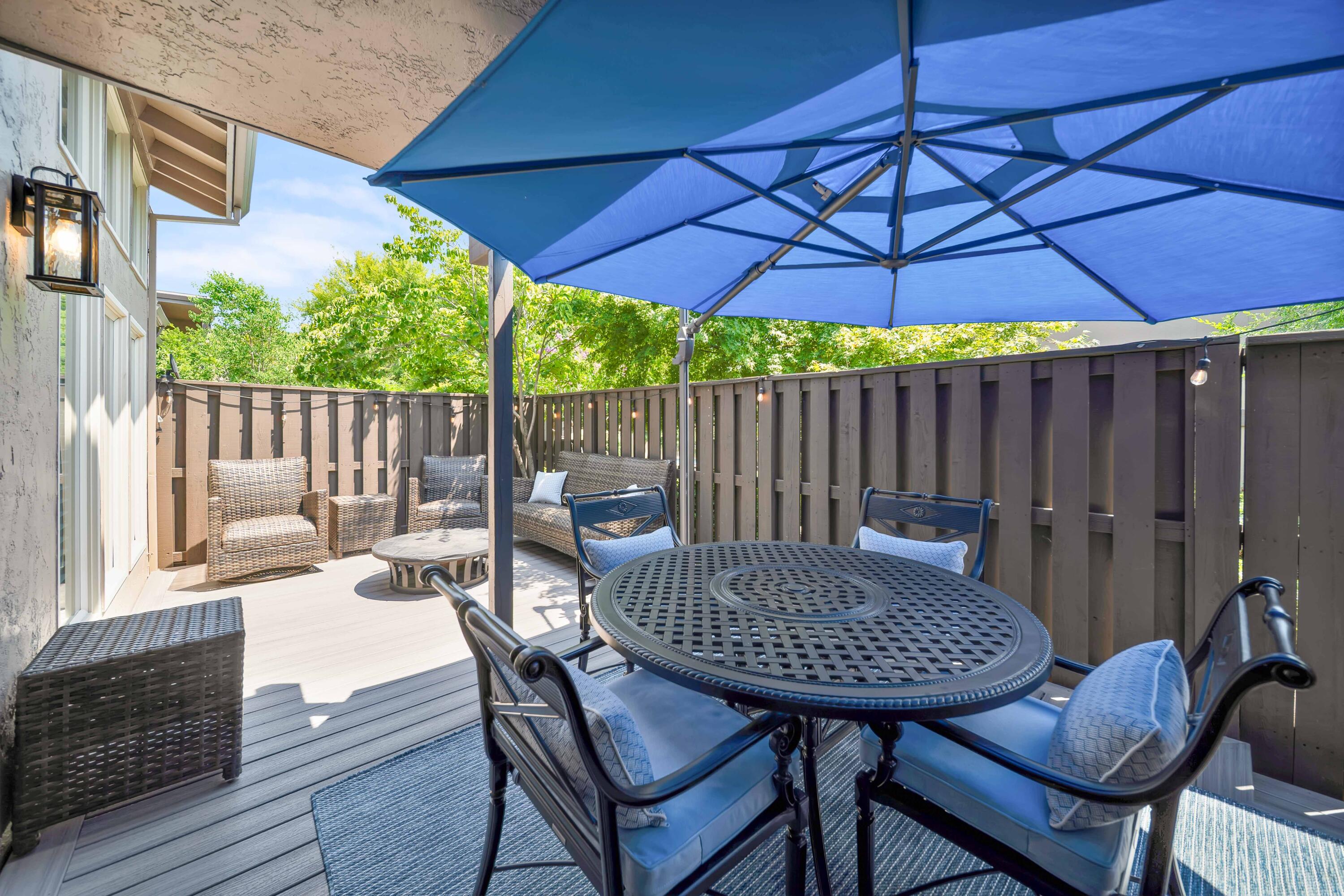 1928 Bechelli Lane Redding, CA 96002 - Photo 42 of 67 a view of a chairs and table under an umbrella