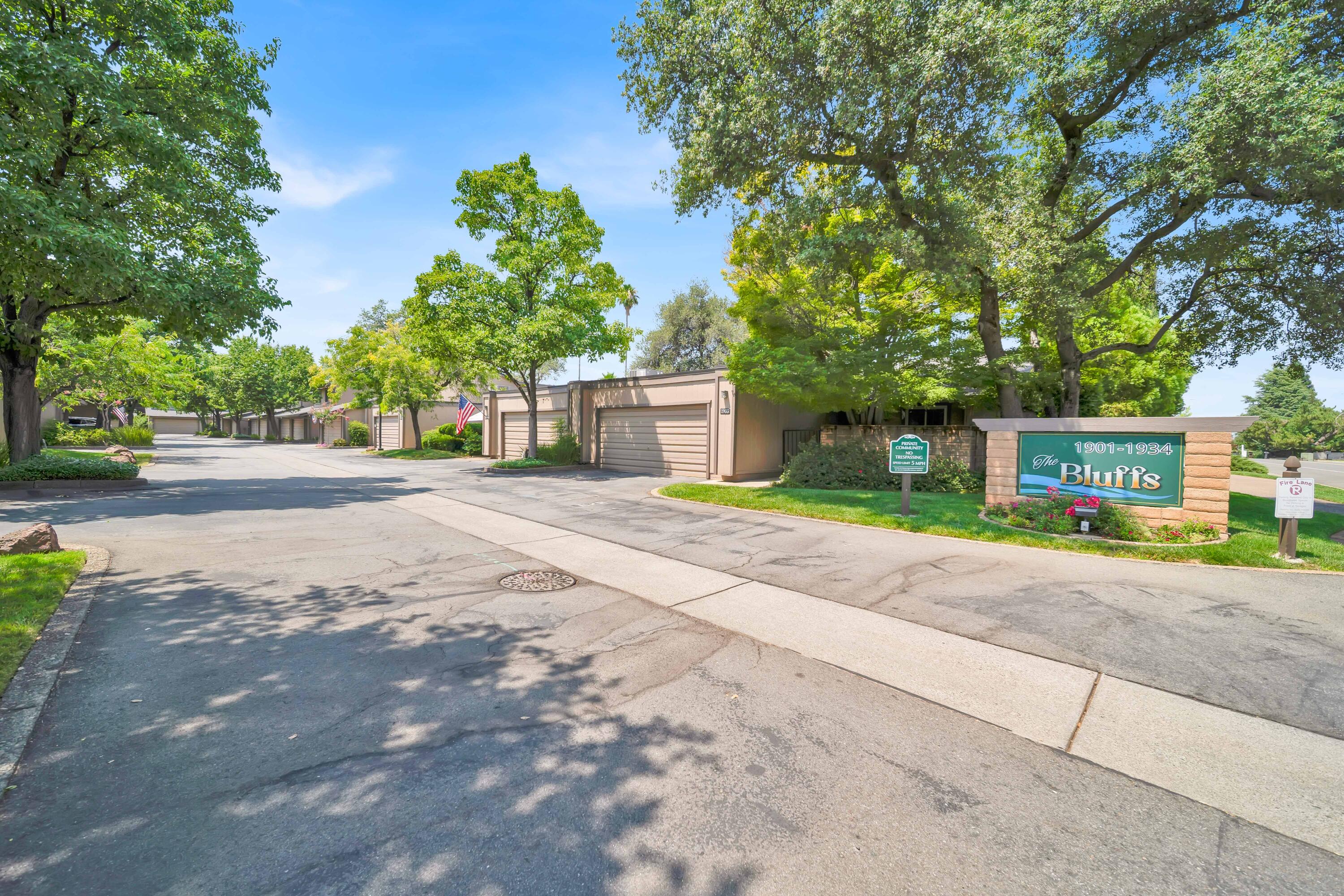 1928 Bechelli Lane Redding, CA 96002 - Photo 49 of 67 a front view of a house with a yard and a garage