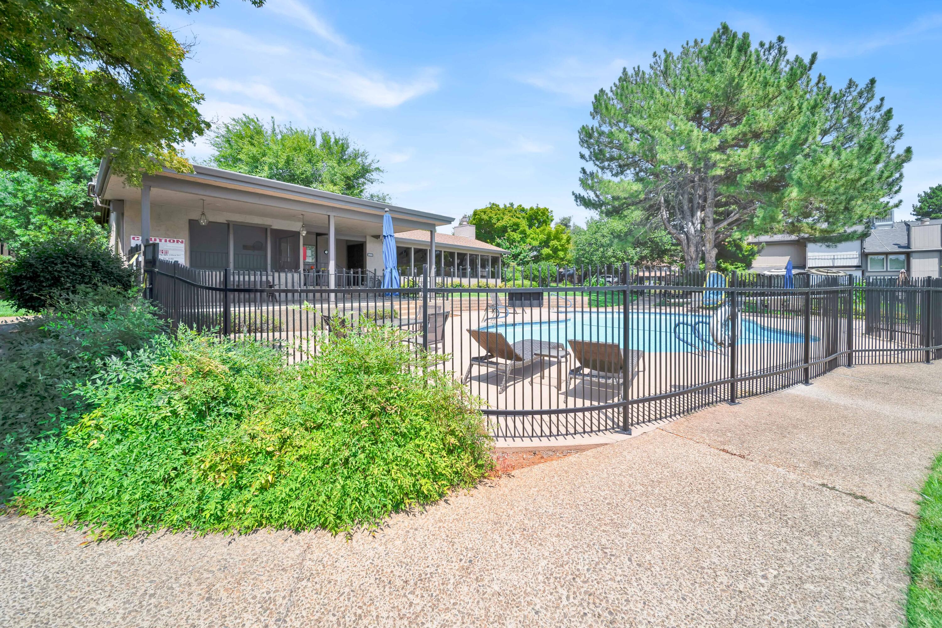 1928 Bechelli Lane Redding, CA 96002 - Photo 57 of 67 a view of a house with a small yard and wooden fence