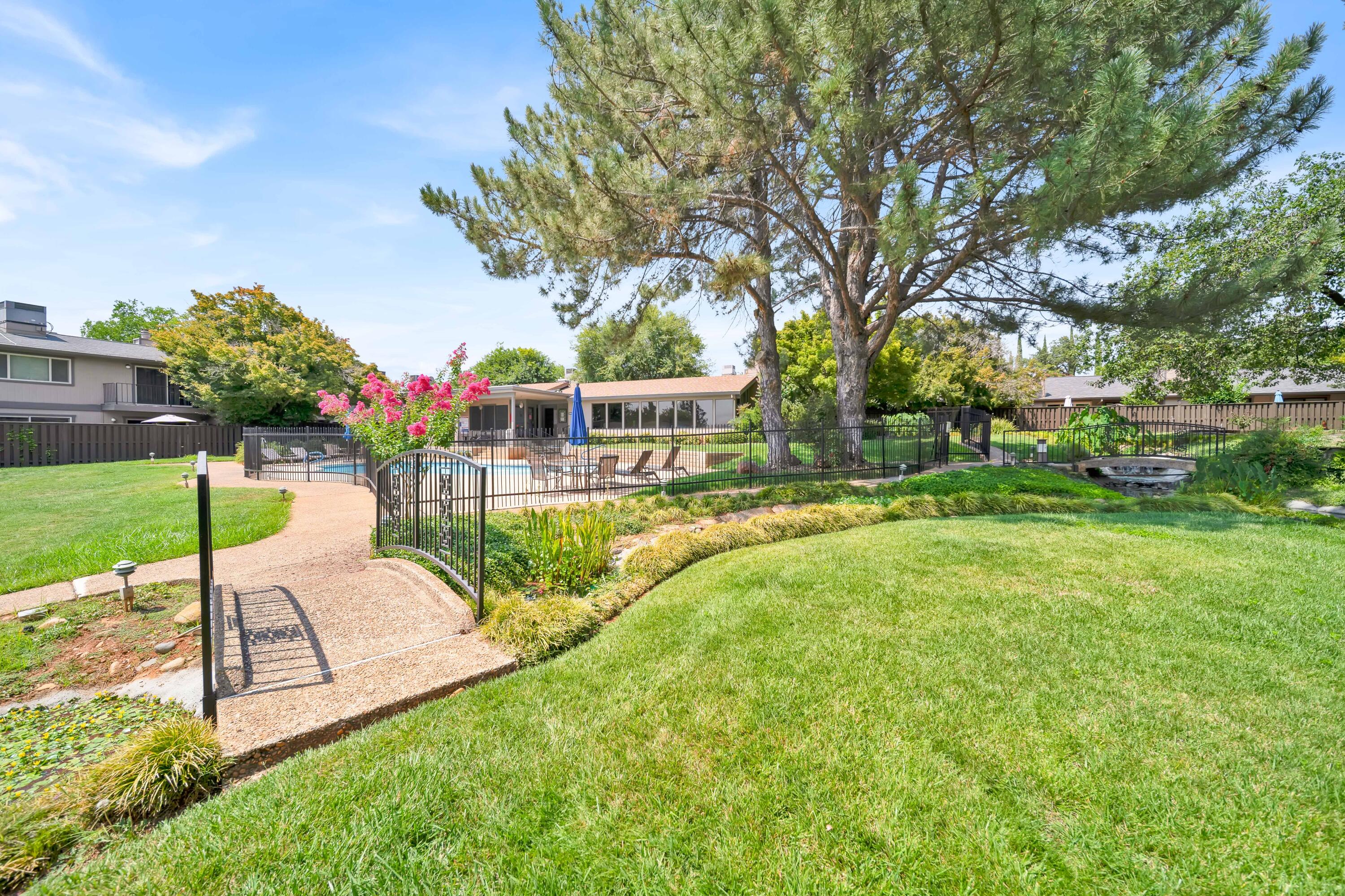 1928 Bechelli Lane Redding, CA 96002 - Photo 59 of 67 a view of a swimming pool with a garden