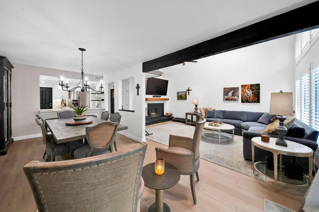 a kitchen with stainless steel appliances granite countertop a sink a stove and cabinets