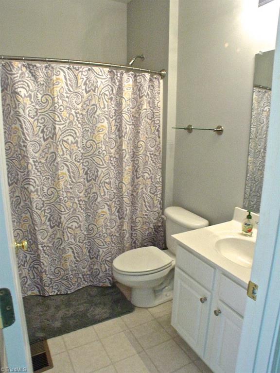 711 Number Ten Way Oak Ridge, NC 27310 - Photo 13 of 25 3rd bath for the 5th bedroom