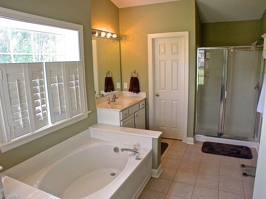 711 Number Ten Way Oak Ridge, NC 27310 - Photo 22 of 25 Master bath also has a private water closet.