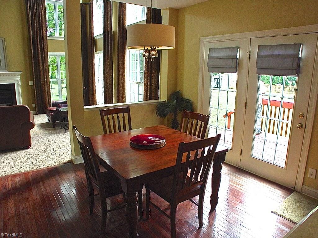 711 Number Ten Way Oak Ridge, NC 27310 - Photo 6 of 25 Breakfast area looks out through the french doors onto deck and backyard.