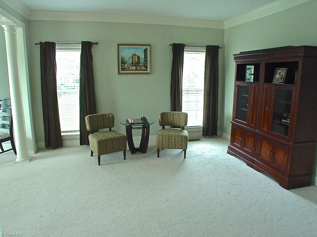 711 Number Ten Way Oak Ridge, NC 27310 - Photo 10 of 25 Living room is open to the Dining room and has nice architectural columns at both entrances.