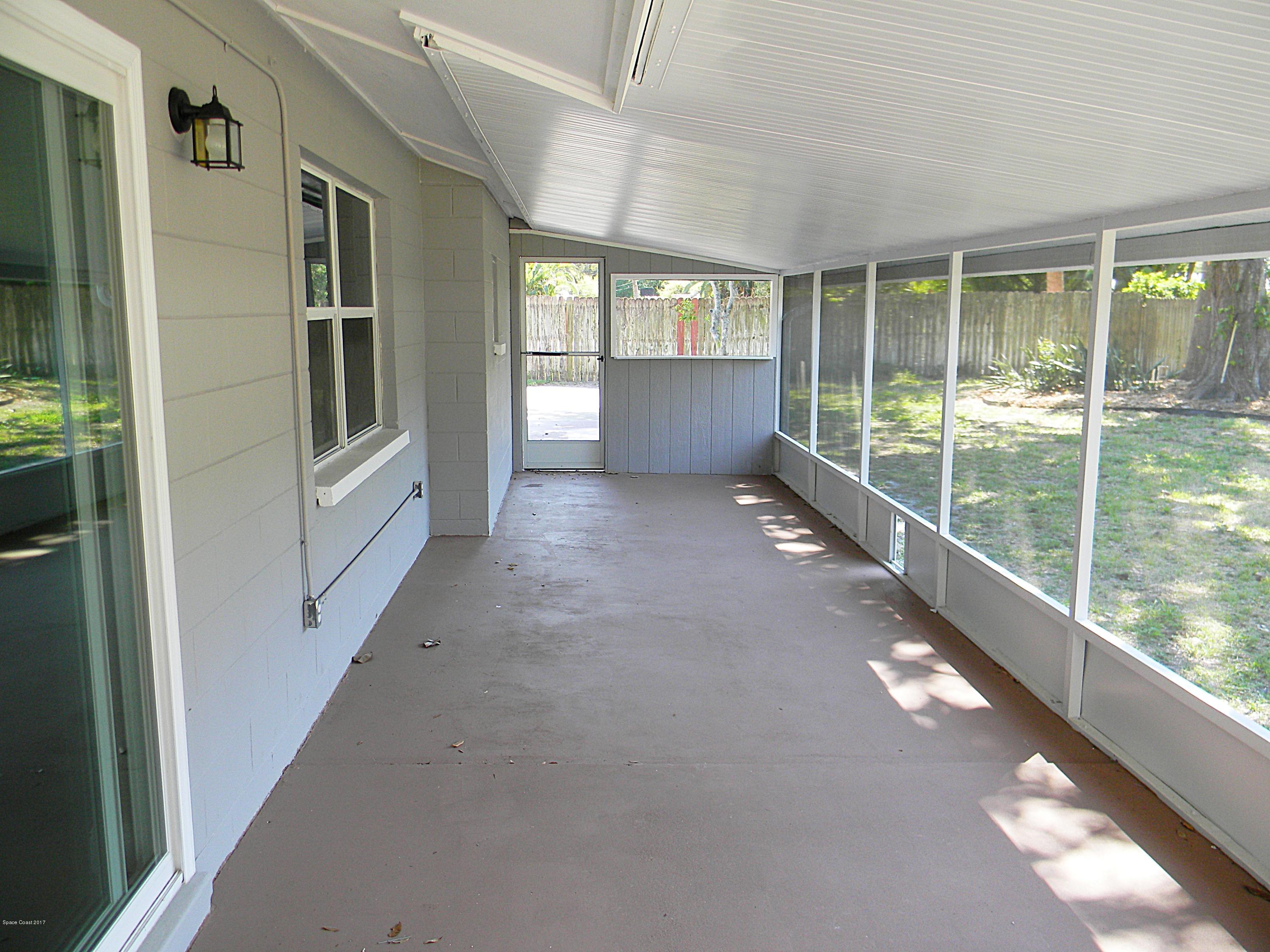 1882 North Carpenter Road Titusville, FL 32796 - Photo 32 of 39 LARGE SCREENED BACK PORCH