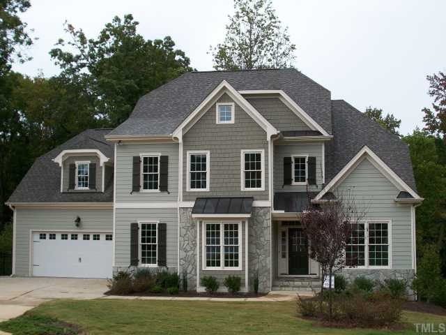 2106 Cook Ridge Court Raleigh, NC 27615 - Photo 1 of 11 a front view of a house with a garden