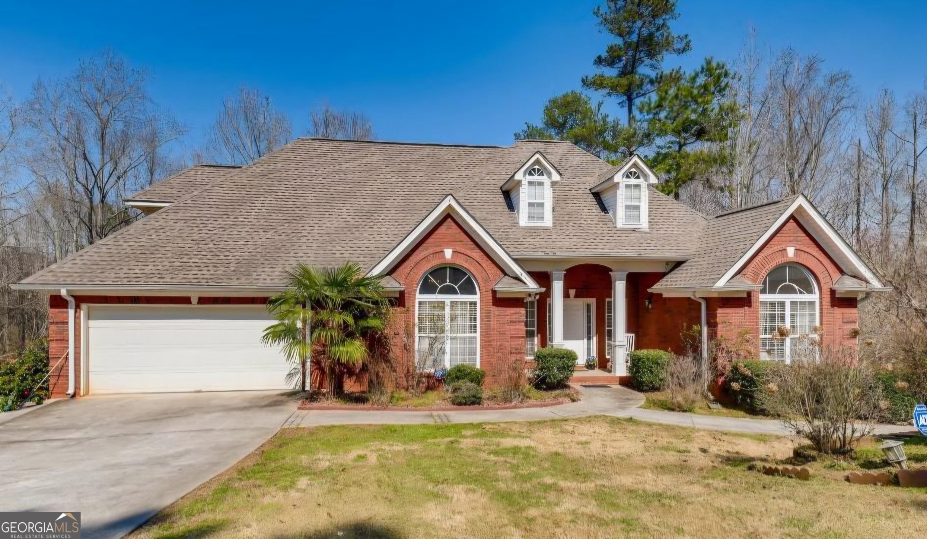 a front view of a house with garden