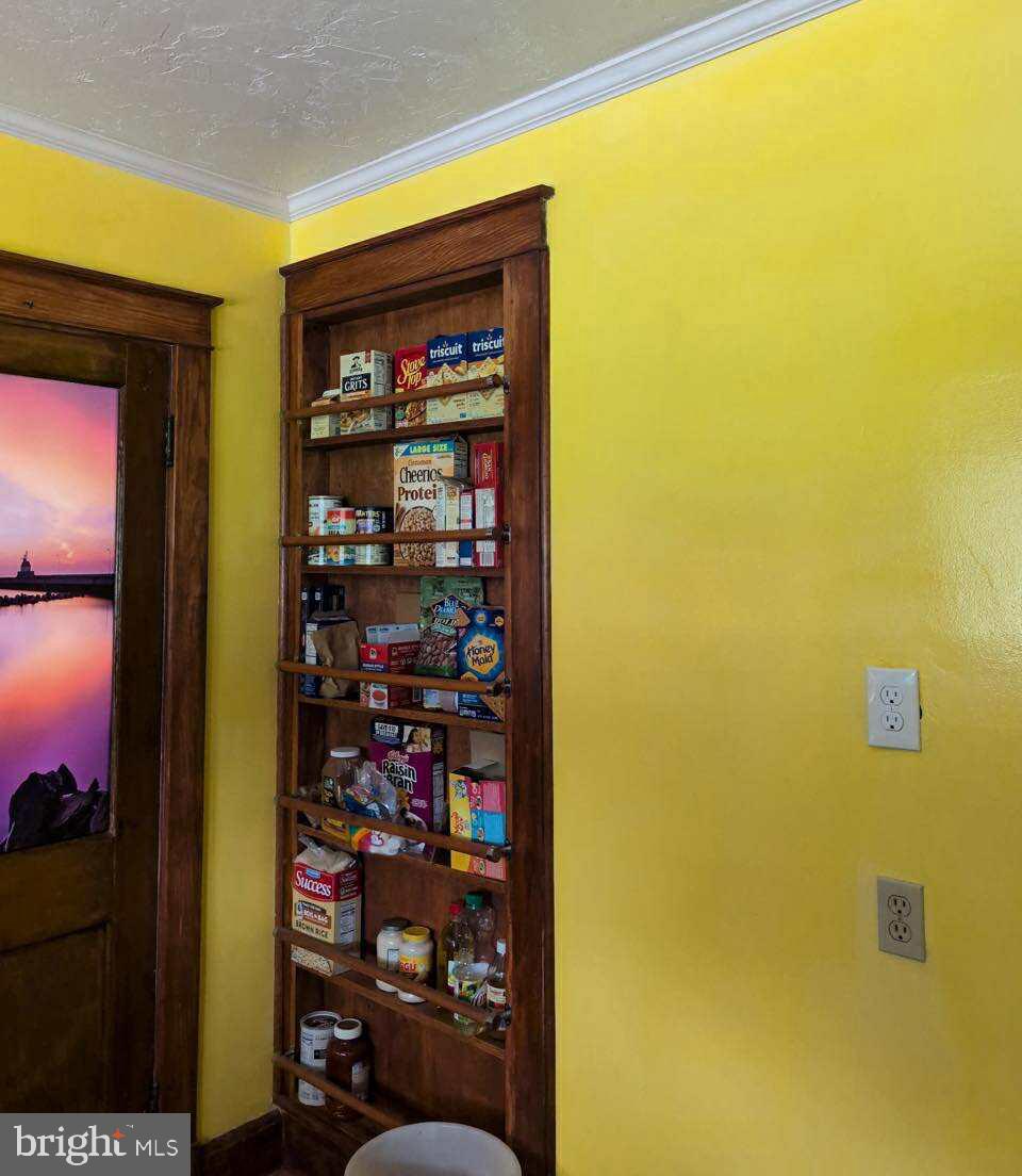 428 East Baltimore Street Taneytown, MD 21787 - Photo 14 of 55 a shelf with wine glasses in front of a door