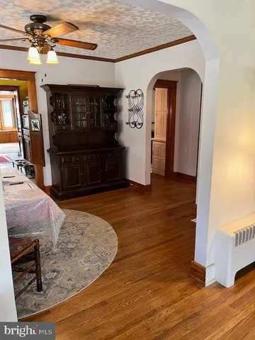 a living room with a gaming machine and a table