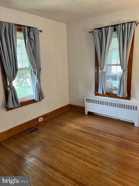 428 East Baltimore Street Taneytown, MD 21787 - Photo 29 of 55 an empty room with wooden floor and windows