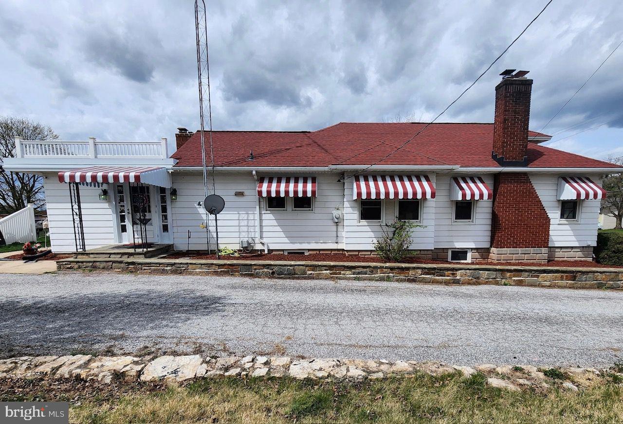428 East Baltimore Street Taneytown, MD 21787 - Photo 4 of 55 a front view of a house with a yard