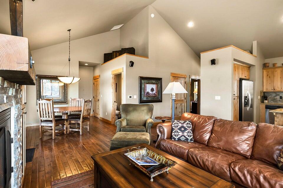 16845 South W Brasada Ranch Road, Unit 23 Powell Butte, OR 97753 - Photo 23 of 47 a living room with furniture and a wooden floor