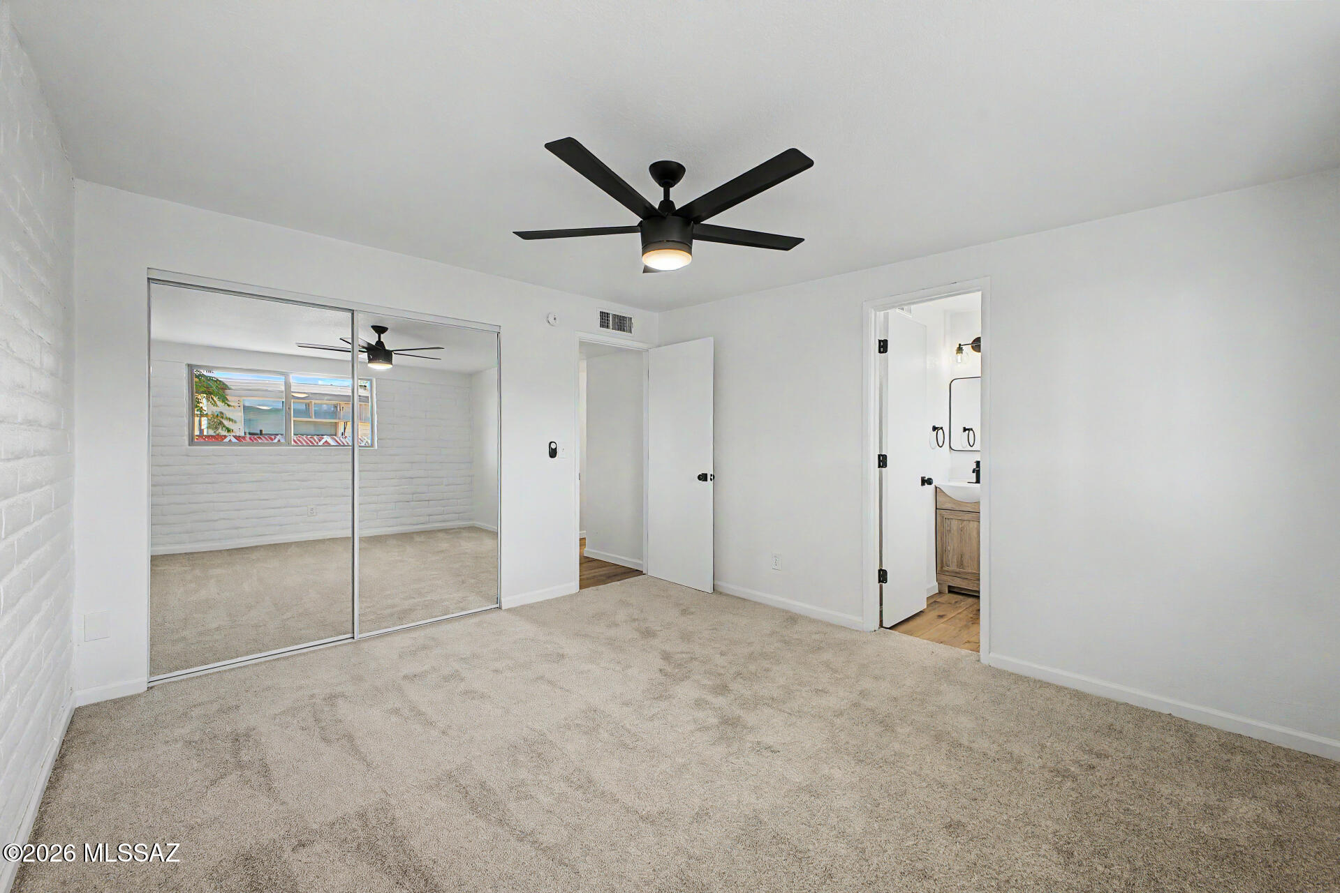 3402 South Kolb Road Tucson, AZ 85730 - Photo 13 of 32 a view of a livingroom with a ceiling fan & entryway