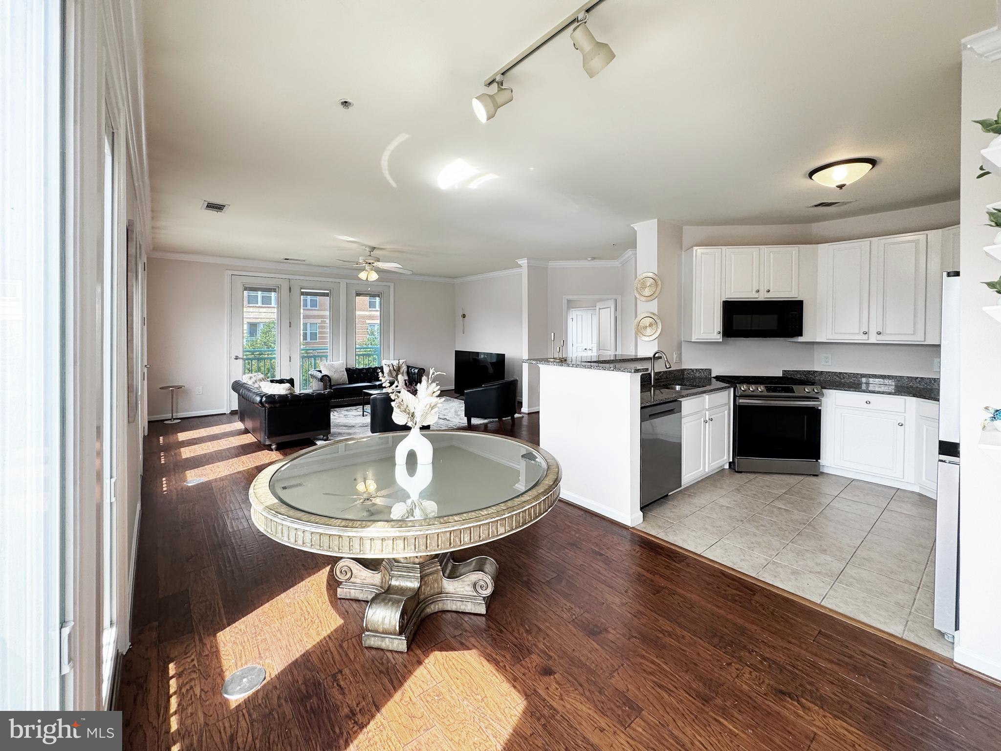 12001 Market Street, Unit 124 Reston, VA 20190 - Photo 6 of 42 Open-Concept Dining Area