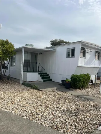a view of a house with a patio