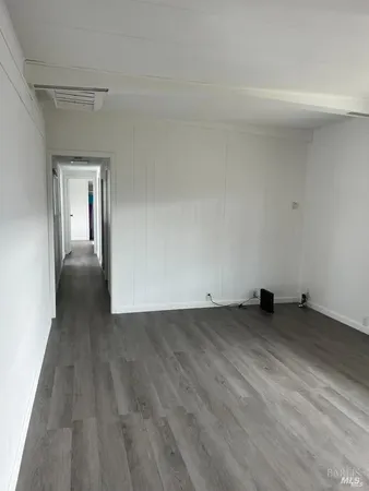 a view of a livingroom with wooden floor