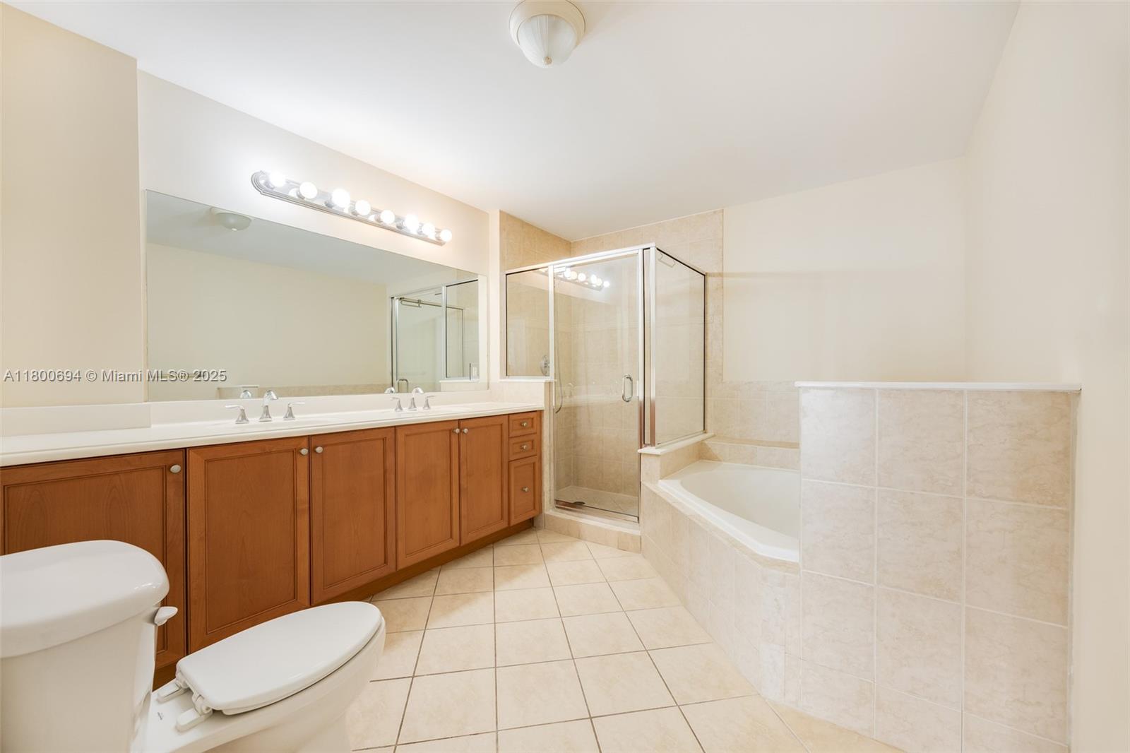 8395 Southwest 73rd Avenue, Unit 320 Miami, FL 33143 - Photo 11 of 18 a bathroom with a sink a toilet and bathtub