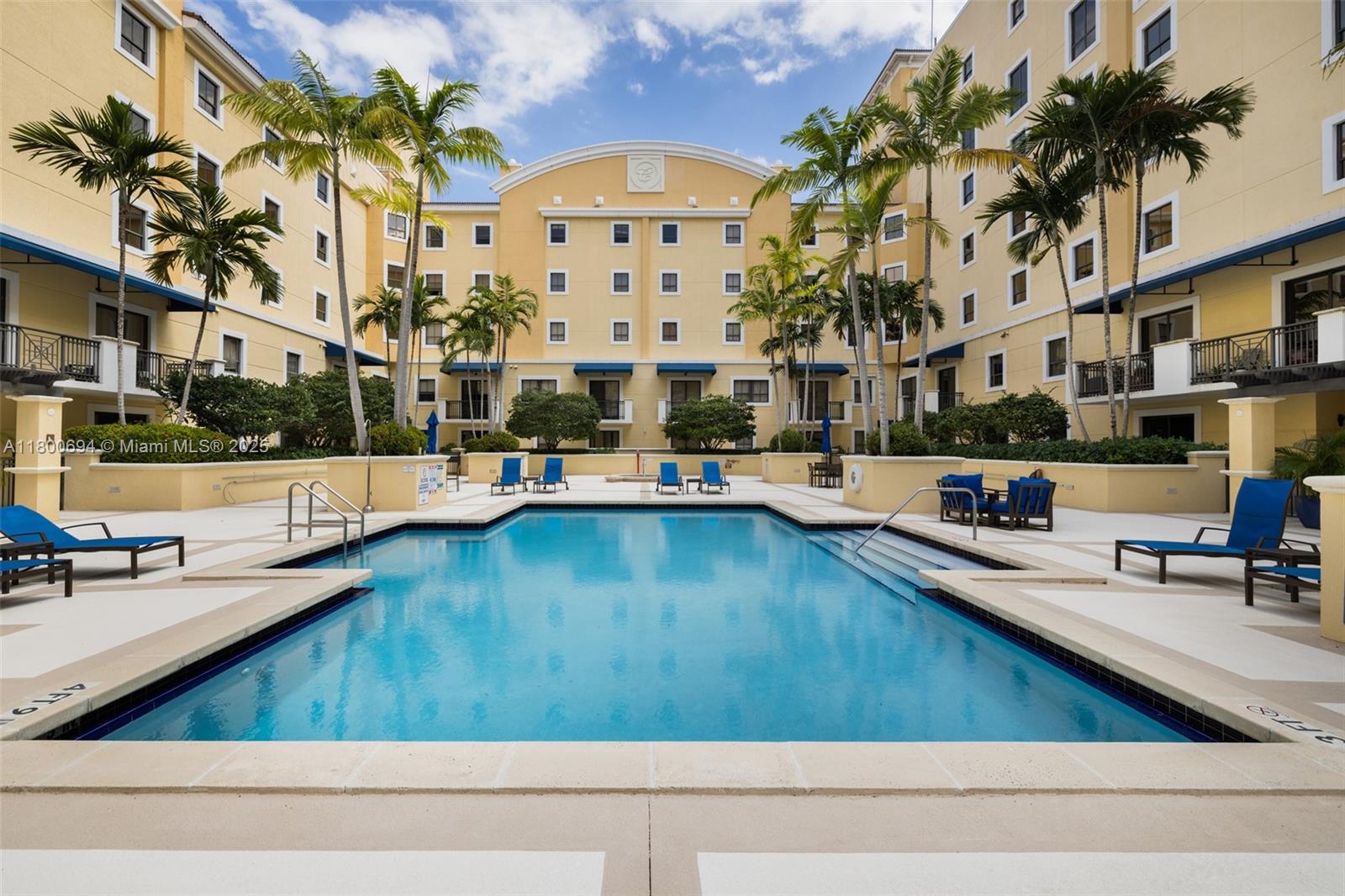 8395 Southwest 73rd Avenue, Unit 320 Miami, FL 33143 - Photo 18 of 18 a view of a building with a swimming pool