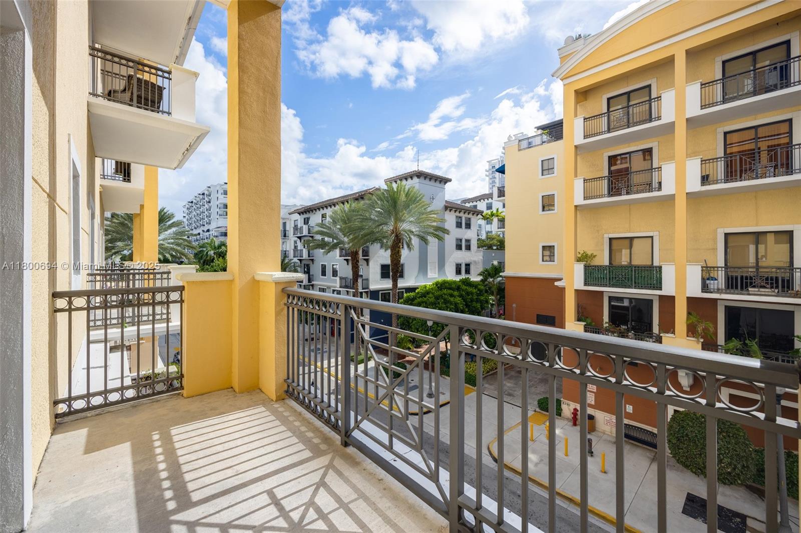 8395 Southwest 73rd Avenue, Unit 320 Miami, FL 33143 - Photo 2 of 18 a view of buildings from the balcony