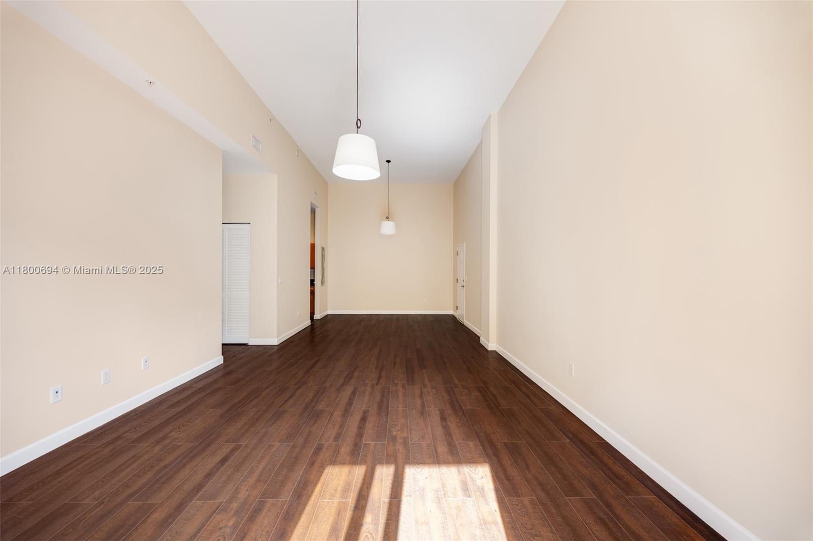8395 Southwest 73rd Avenue, Unit 320 Miami, FL 33143 - Photo 5 of 18 a view of a hallway with wooden floor