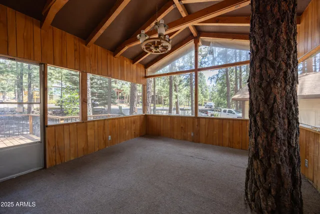 a view of an empty room with a large window