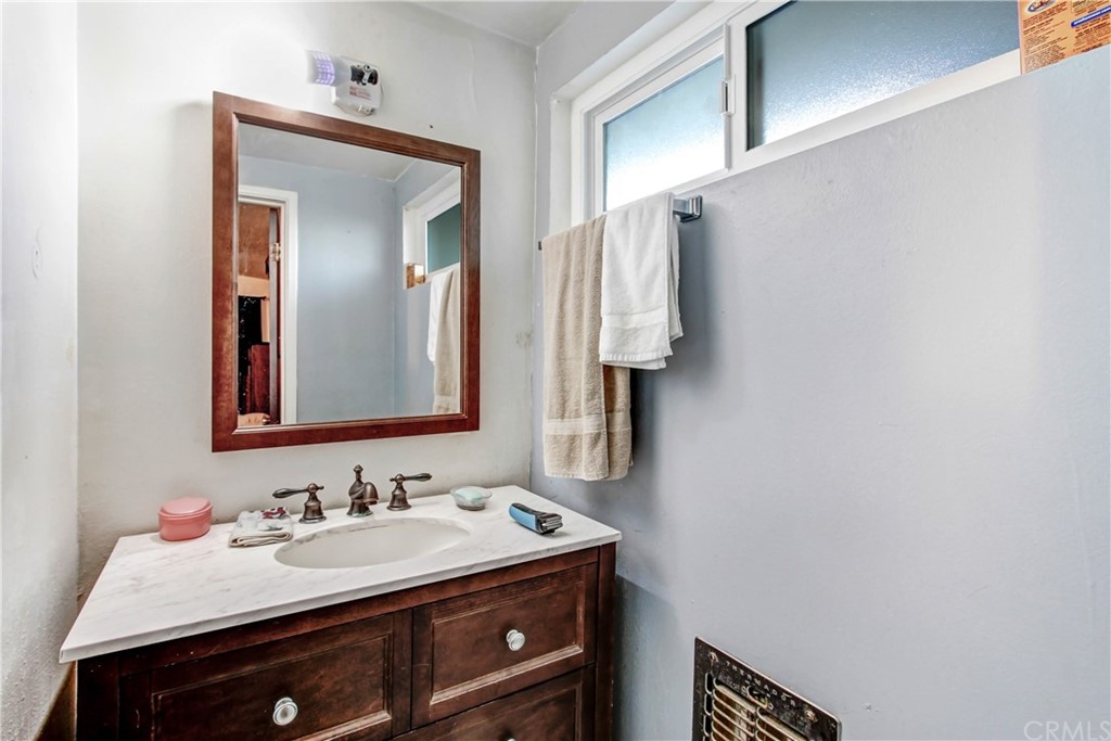 61495 La Jolla Drive Joshua Tree, CA 92252 - Photo 18 of 21 a bathroom with a sink and a mirror