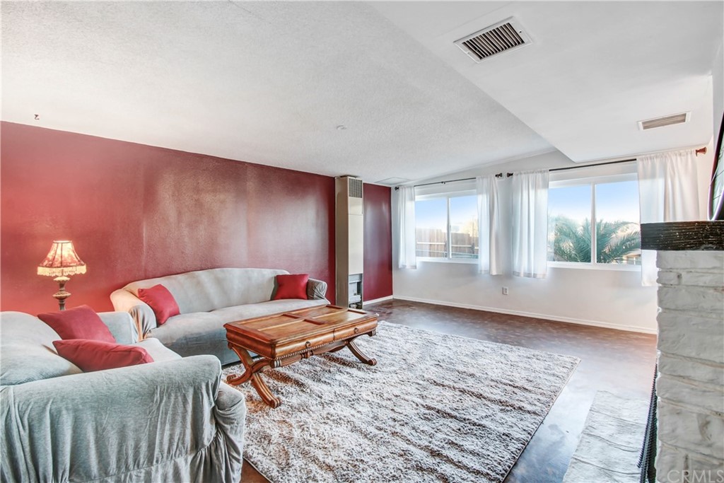 61495 La Jolla Drive Joshua Tree, CA 92252 - Photo 7 of 21 a living room with furniture and a table