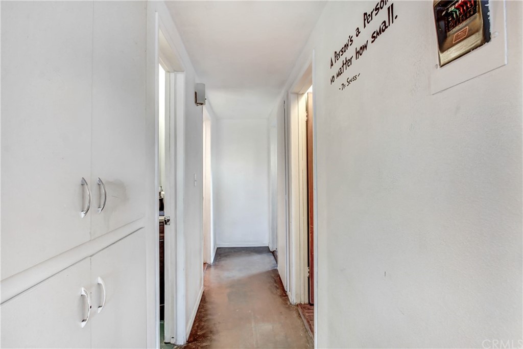 61495 La Jolla Drive Joshua Tree, CA 92252 - Photo 9 of 21 a view of a hallway with wooden floor and staircase