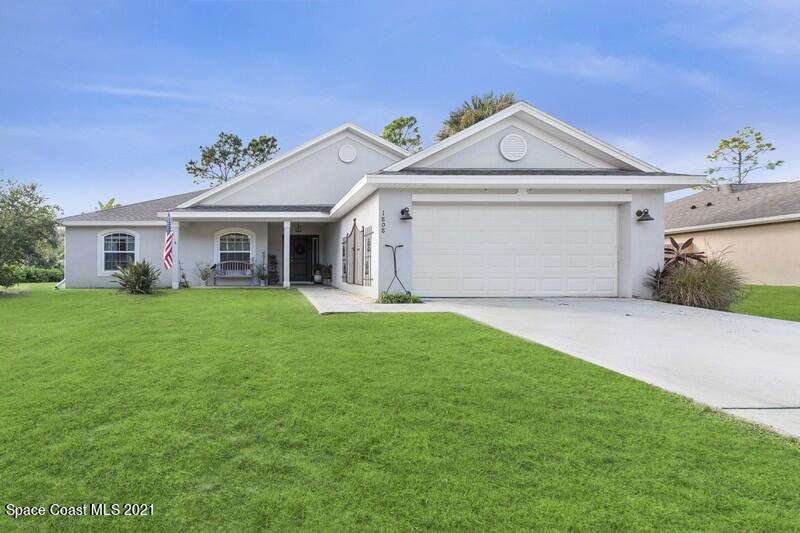 1808 Holbrook Road Northwest Palm Bay, FL 32907 - Photo 1 of 28 a view of house with garden