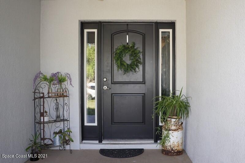 1808 Holbrook Road Northwest Palm Bay, FL 32907 - Photo 2 of 28 view of a entryway door of the house