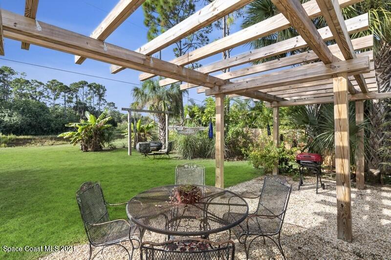 1808 Holbrook Road Northwest Palm Bay, FL 32907 - Photo 15 of 28 a view of yard with patio