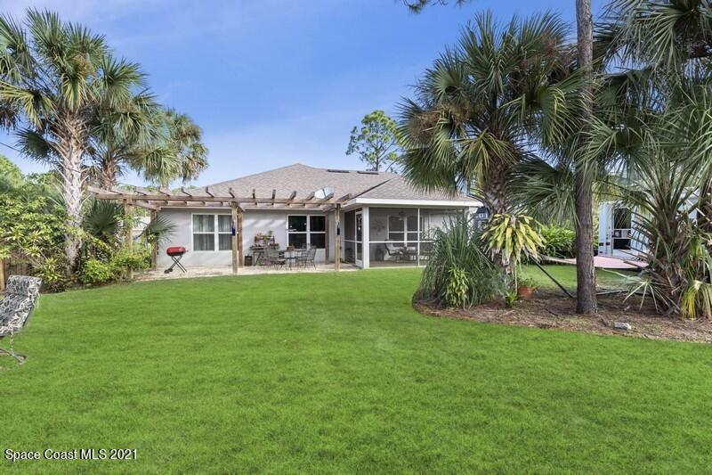 1808 Holbrook Road Northwest Palm Bay, FL 32907 - Photo 16 of 28 a view of a house with a yard