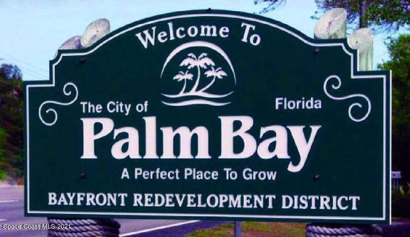 1808 Holbrook Road Northwest Palm Bay, FL 32907 - Photo 17 of 28 a front of a front of a building with parking area