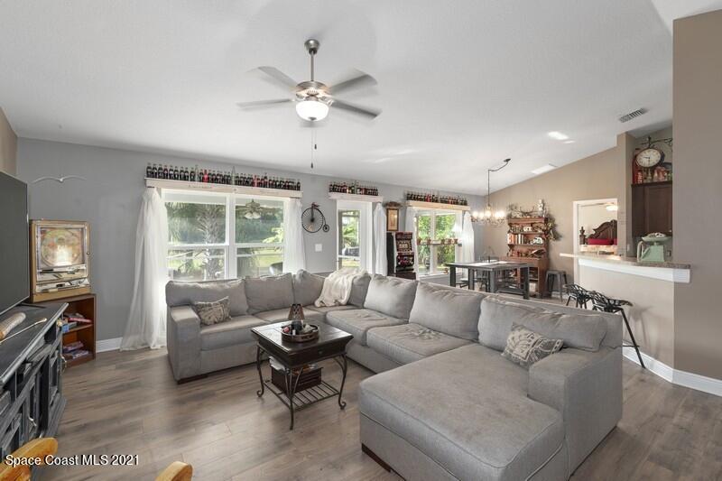 1808 Holbrook Road Northwest Palm Bay, FL 32907 - Photo 3 of 28 a living room with furniture and a large window