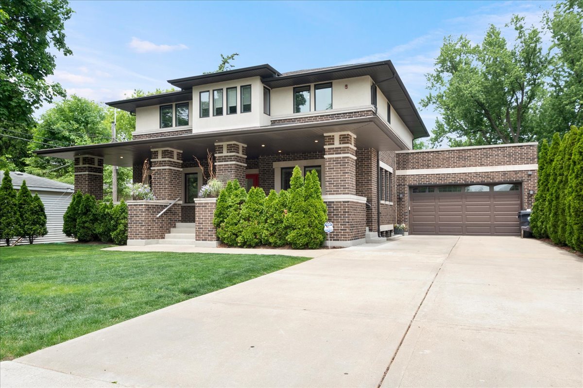2921 Simpson Street Evanston, IL 60201 - Photo 2 of 41 a front view of a house with a yard and garage