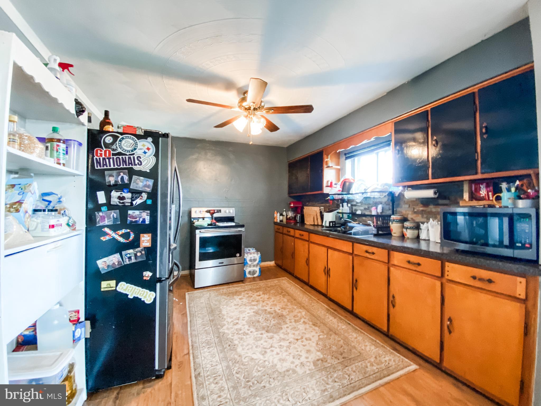 3743 Chestnut Ridge Road Grantsville, MD 21536 - Photo 5 of 14 a kitchen with stainless steel appliances granite countertop a refrigerator and a sink