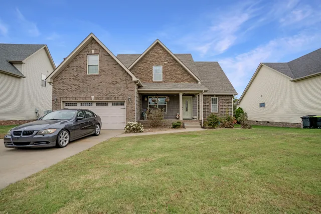 a view of a car parked in front of a house