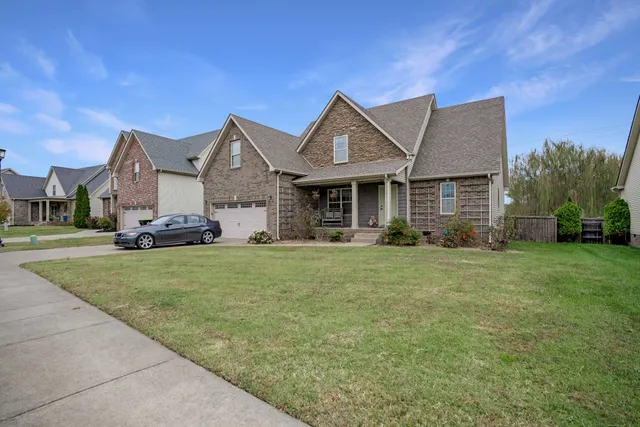 a front view of a house with a yard
