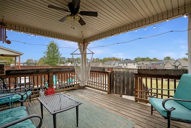 a view of a balcony with furniture