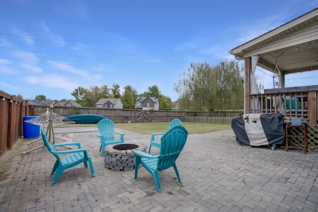 a view of a swimming pool with a lounge chair