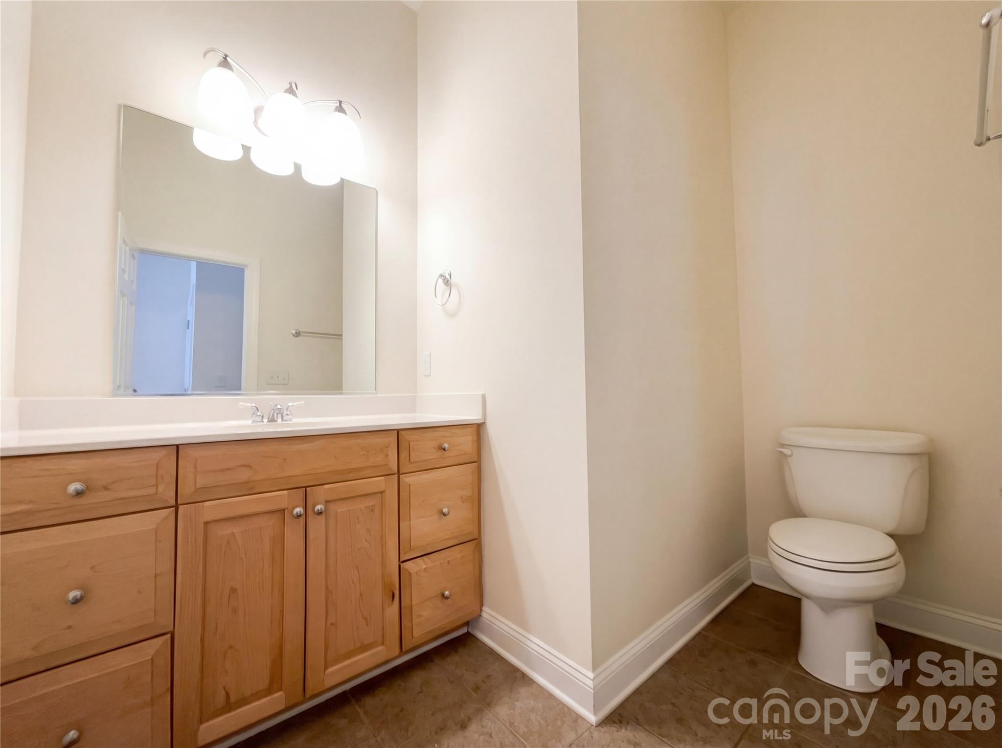 405 Isle Of Pines Road Mooresville, NC 28117 - Photo 12 of 18 a spacious bathroom with a toilet sink and mirror